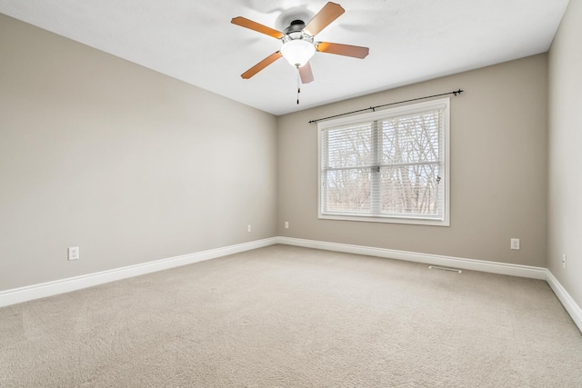 10693 Bear Lake Trl, Portage, MI 49024 - unfurnished room featuring baseboards, a ceiling fan, and light colored carpet