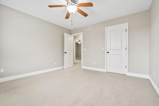 10693 Bear Lake Trl, Portage, MI 49024 - unfurnished bedroom featuring baseboards, light colored carpet, and ceiling fan