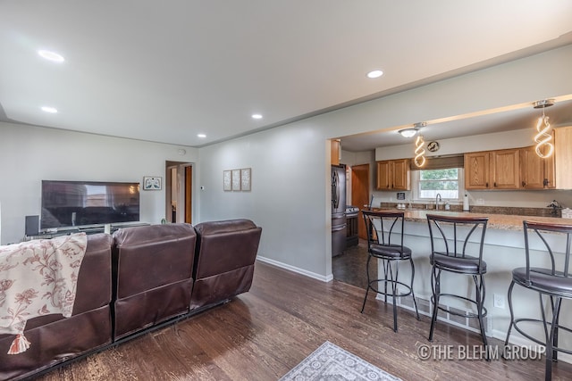 544 Shawmut Blvd NW, Grand Rapids, MI 49504 - living room with dark wood-style flooring and recessed lighting