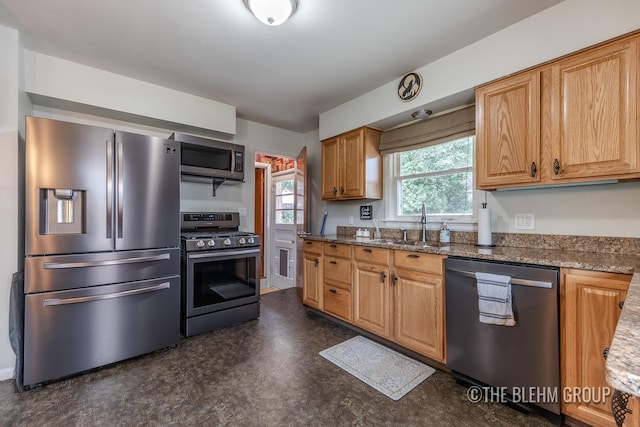 544 Shawmut Blvd NW, Grand Rapids, MI 49504 - kitchen with stainless steel appliances and dark stone countertops