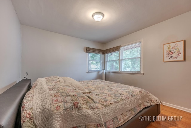 544 Shawmut Blvd NW, Grand Rapids, MI 49504 - bedroom with light wood-style floors and baseboards