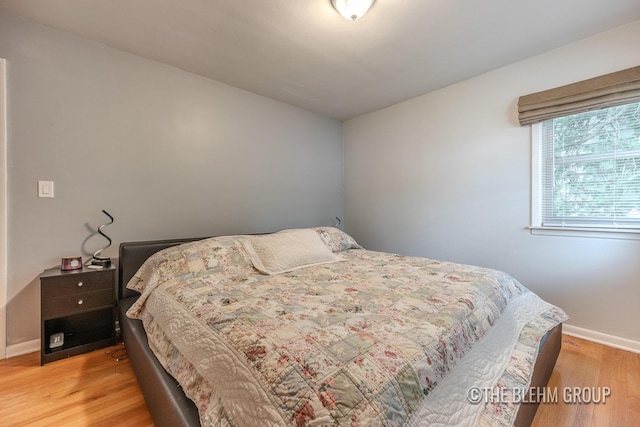 544 Shawmut Blvd NW, Grand Rapids, MI 49504 - bedroom featuring baseboards and light wood-style flooring