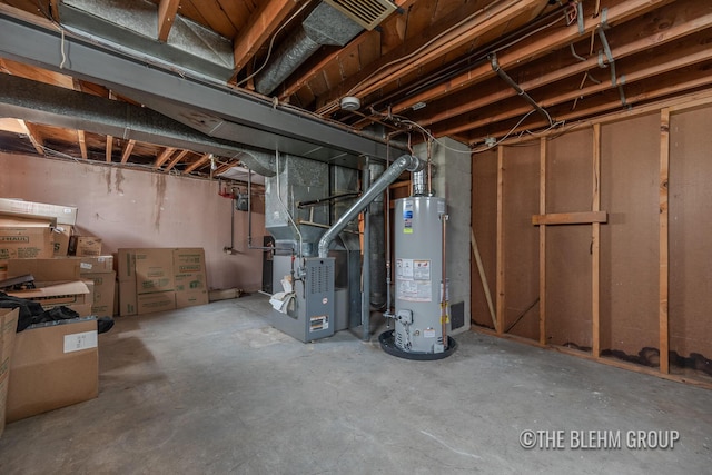 544 Shawmut Blvd NW, Grand Rapids, MI 49504 - unfinished below grade area featuring water heater and heating unit