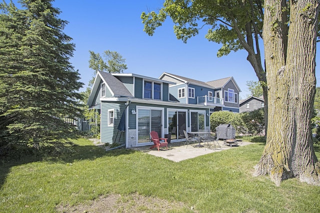 2019 Lakeview Dr, Portage, MI 49002 - back of house featuring a patio area, a balcony, and a yard