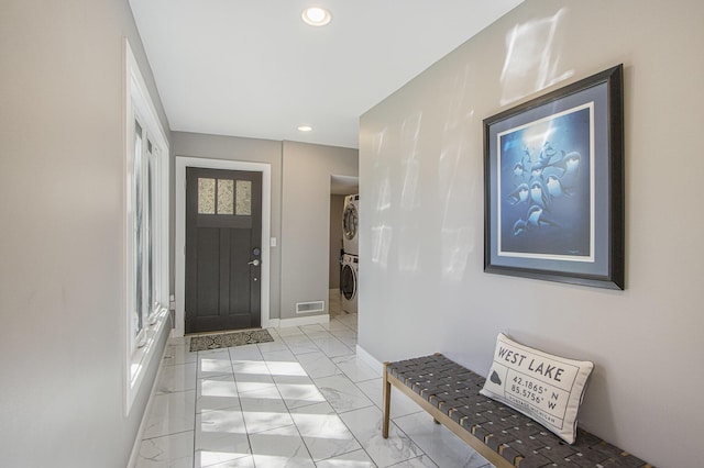 2019 Lakeview Dr, Portage, MI 49002 - entrance foyer featuring stacked washer / drying machine, baseboards, light marble finish floors, and recessed lighting