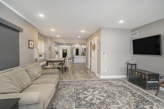 2019 Lakeview Dr, Portage, MI 49002 - living area featuring light wood-type flooring, recessed lighting, and baseboards