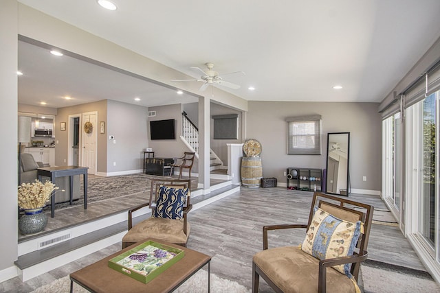 2019 Lakeview Dr, Portage, MI 49002 - living area with baseboards, recessed lighting, stairs, wood finished floors, and a ceiling fan