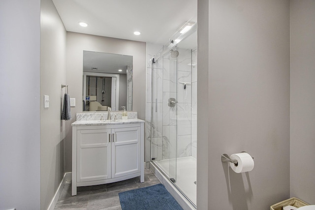 2019 Lakeview Dr, Portage, MI 49002 - bathroom with a stall shower, vanity, recessed lighting, and baseboards