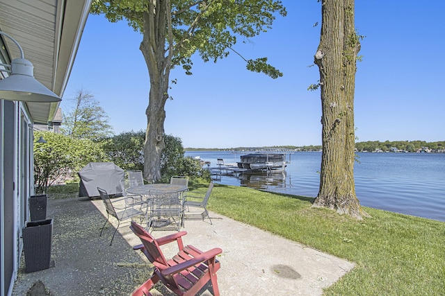 2019 Lakeview Dr, Portage, MI 49002 - view of patio / terrace featuring grilling area, a water view, and a dock