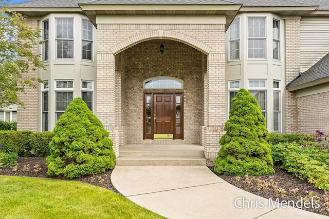 150 Bay Circle Dr, Holland, MI 49424 - doorway to property with brick siding and roof with shingles