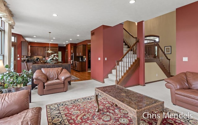 150 Bay Circle Dr, Holland, MI 49424 - living area featuring stairway, light carpet, healthy amount of natural light, and recessed lighting