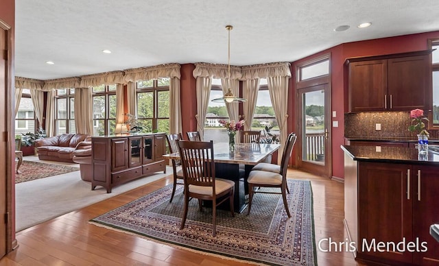 150 Bay Circle Dr, Holland, MI 49424 - dining room featuring a textured ceiling, light wood-style flooring, and recessed lighting