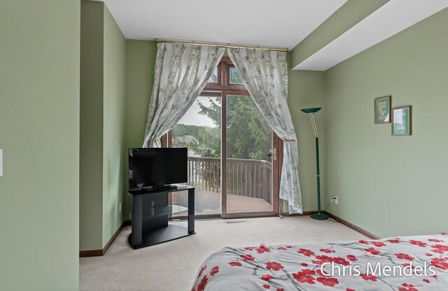 150 Bay Circle Dr, Holland, MI 49424 - bedroom featuring carpet, access to exterior, and baseboards