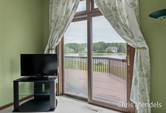 150 Bay Circle Dr, Holland, MI 49424 - doorway to outside with carpet flooring