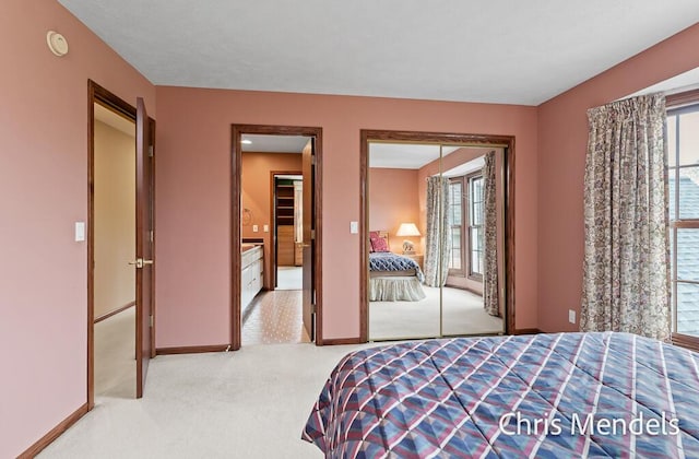 150 Bay Circle Dr, Holland, MI 49424 - bedroom with multiple windows, carpet floors, and baseboards