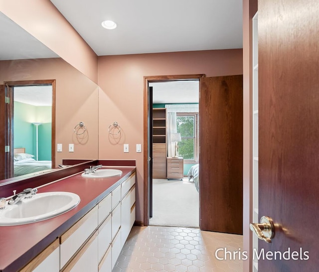 150 Bay Circle Dr, Holland, MI 49424 - full bath featuring ensuite bath, double vanity, tile patterned flooring, and recessed lighting