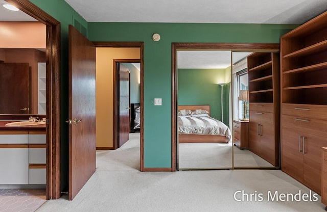 150 Bay Circle Dr, Holland, MI 49424 - carpeted bedroom featuring a sink