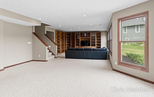 150 Bay Circle Dr, Holland, MI 49424 - unfurnished living room with carpet floors, baseboards, stairs, and recessed lighting