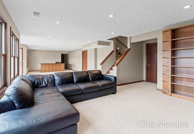 150 Bay Circle Dr, Holland, MI 49424 - living room with light carpet, baseboards, recessed lighting, and stairs