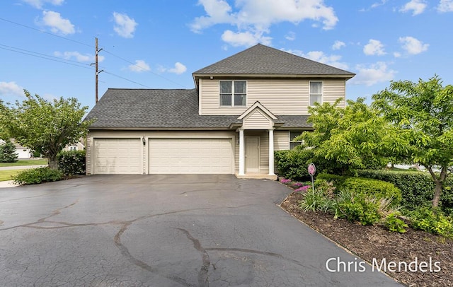 150 Bay Circle Dr, Holland, MI 49424 - traditional-style home featuring driveway, roof with shingles, and a garage
