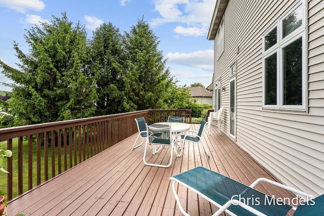 150 Bay Circle Dr, Holland, MI 49424 - wooden deck featuring outdoor dining area