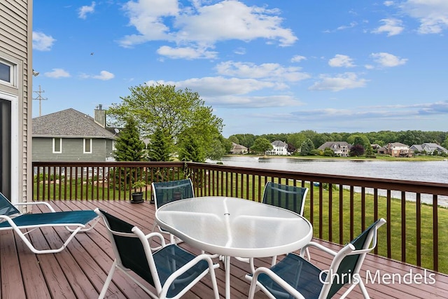 150 Bay Circle Dr, Holland, MI 49424 - deck featuring a water view, a yard, and outdoor dining area