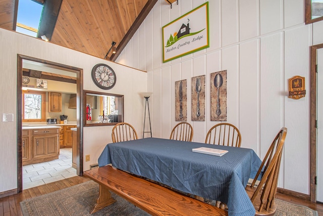9701 Kruger Rd, Union Pier, MI 49129 - dining room featuring light wood-type flooring, high vaulted ceiling, wooden ceiling, and wood walls