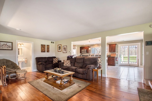 9701 Kruger Rd, Union Pier, MI 49129 - living room with light wood-style floors and baseboards