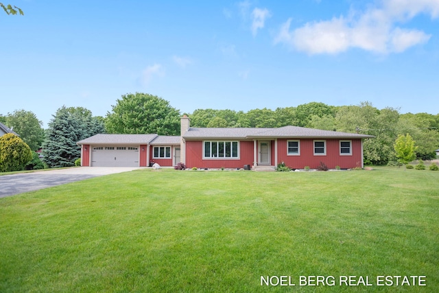 16507 Sleeper St, Grand Haven, MI 49417 - ranch-style house featuring asphalt driveway, a garage, a front yard, and a chimney