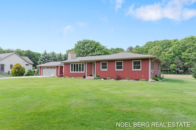 16507 Sleeper St, Grand Haven, MI 49417 - single story home featuring concrete driveway, an attached garage, a chimney, a front yard, and board and batten siding