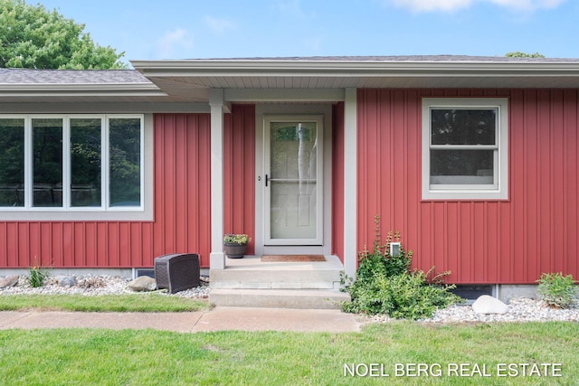 16507 Sleeper St, Grand Haven, MI 49417 - doorway to property featuring board and batten siding