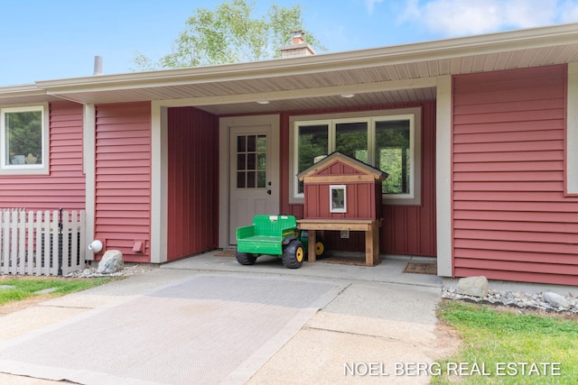 16507 Sleeper St, Grand Haven, MI 49417 - doorway to property with a chimney