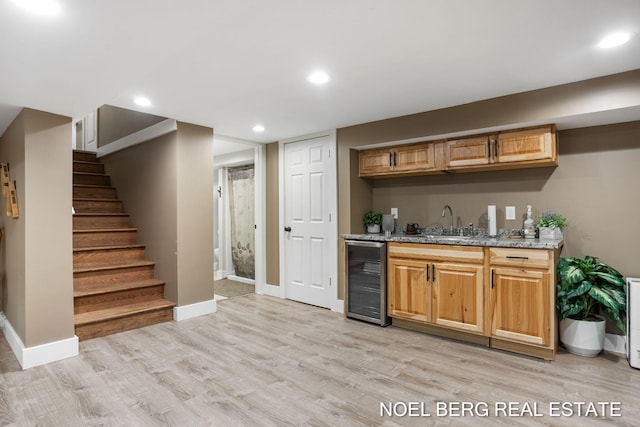16507 Sleeper St, Grand Haven, MI 49417 - indoor wet bar with wine cooler, light wood-style floors, baseboards, and recessed lighting