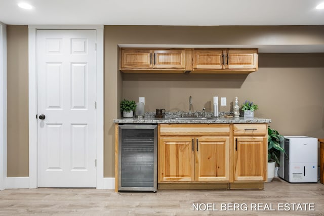 16507 Sleeper St, Grand Haven, MI 49417 - indoor wet bar with beverage cooler, light wood-style floors, and recessed lighting