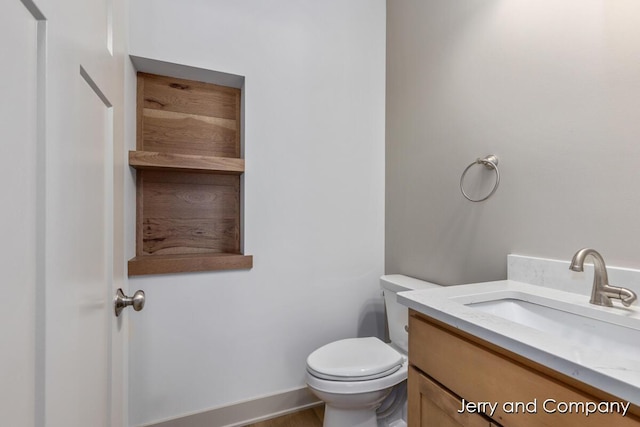2076 W Lakewood Blvd, Holland, MI 49424 - bathroom with vanity and toilet