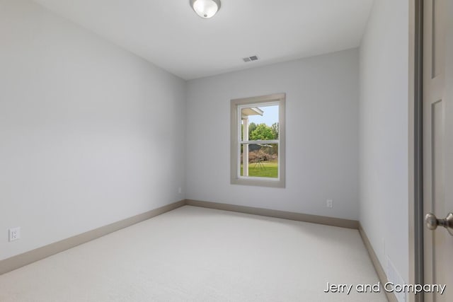2076 W Lakewood Blvd, Holland, MI 49424 - carpeted spare room featuring baseboards