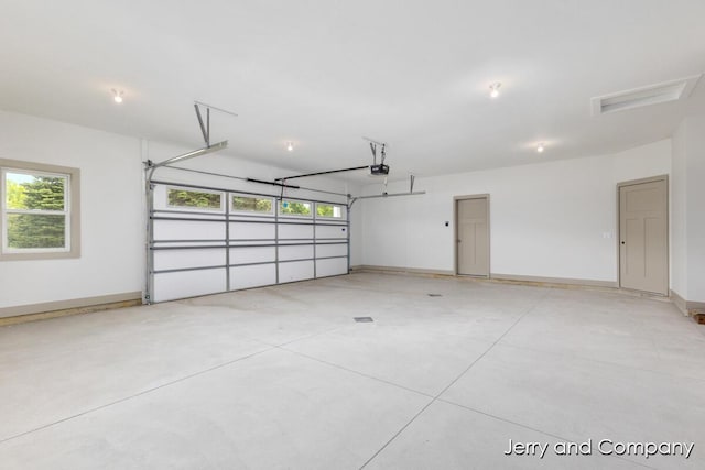 2076 W Lakewood Blvd, Holland, MI 49424 - garage with a garage door opener and baseboards