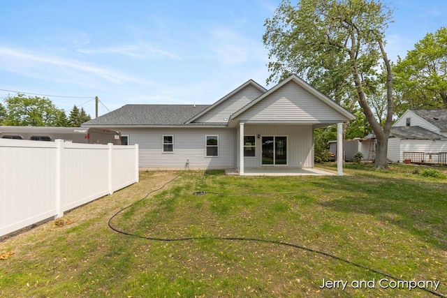2076 W Lakewood Blvd, Holland, MI 49424 - back of house with a patio area