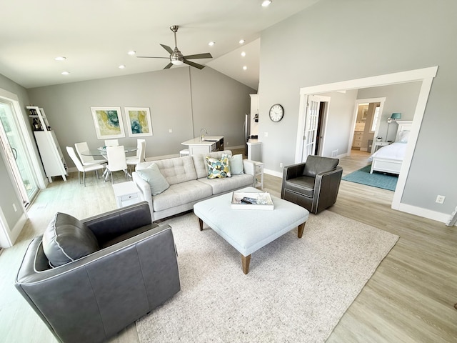 3633 Marina View Pt, Muskegon, MI 49441 - living room featuring light wood-type flooring, baseboards, recessed lighting, ceiling fan, and high vaulted ceiling