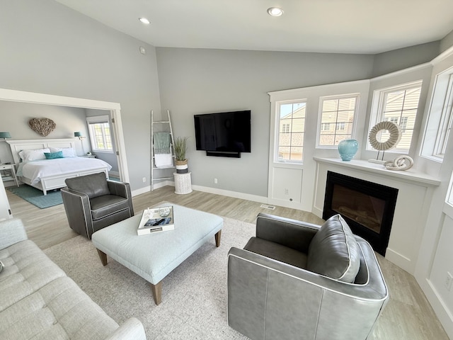 3633 Marina View Pt, Muskegon, MI 49441 - living room featuring a glass covered fireplace, light wood finished floors, plenty of natural light, recessed lighting, and baseboards