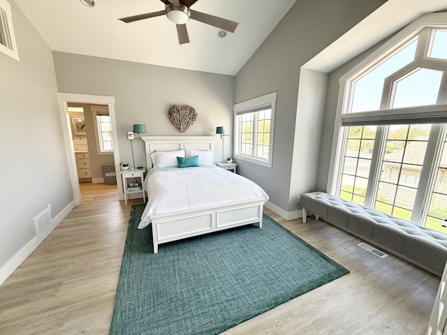 3633 Marina View Pt, Muskegon, MI 49441 - bedroom with high vaulted ceiling, baseboards, wood finished floors, and a ceiling fan