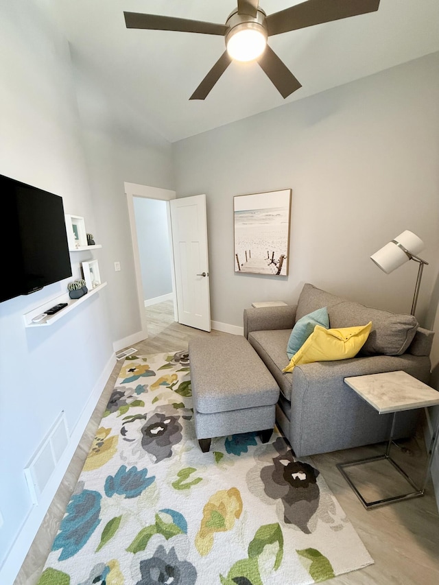 3633 Marina View Pt, Muskegon, MI 49441 - living room with a ceiling fan, wood finished floors, baseboards, and vaulted ceiling