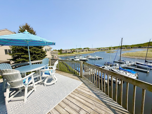 3633 Marina View Pt, Muskegon, MI 49441 - wooden terrace with a water view and outdoor dining space