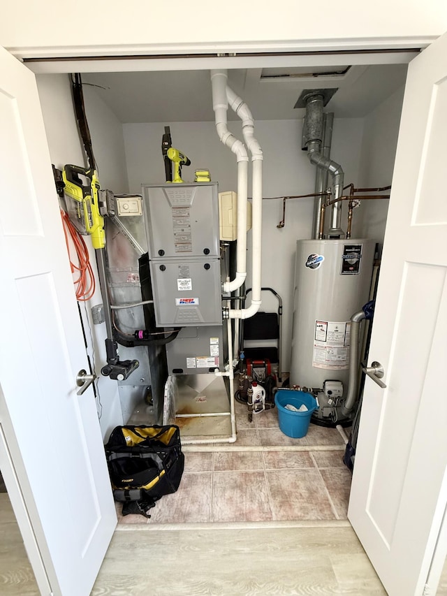 3633 Marina View Pt, Muskegon, MI 49441 - utility room featuring gas water heater