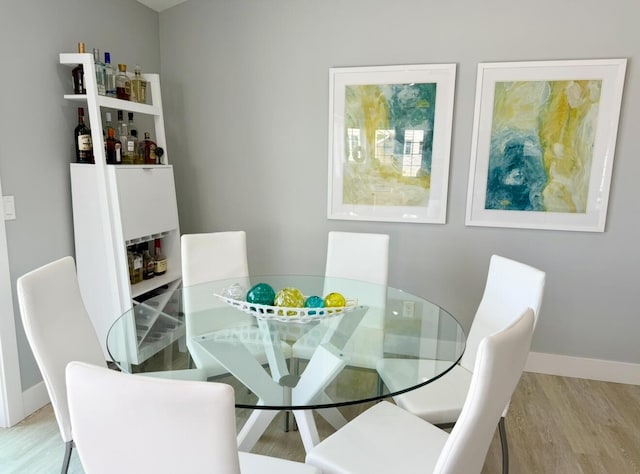 3633 Marina View Pt, Muskegon, MI 49441 - dining room featuring wood finished floors and baseboards