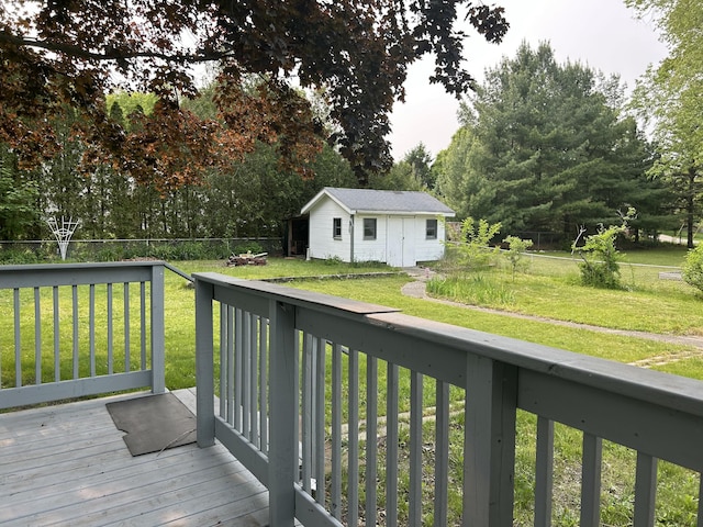 1283 Vesta Rd, Muskegon, MI 49445 - wooden deck with an outbuilding and a yard