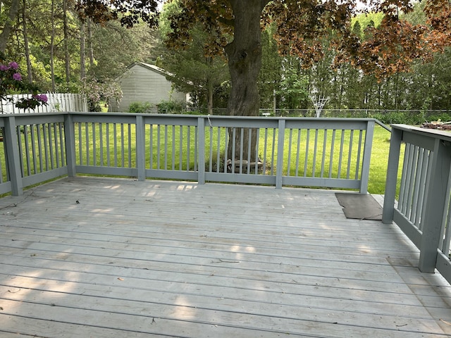 1283 Vesta Rd, Muskegon, MI 49445 - wooden deck with view of scattered trees