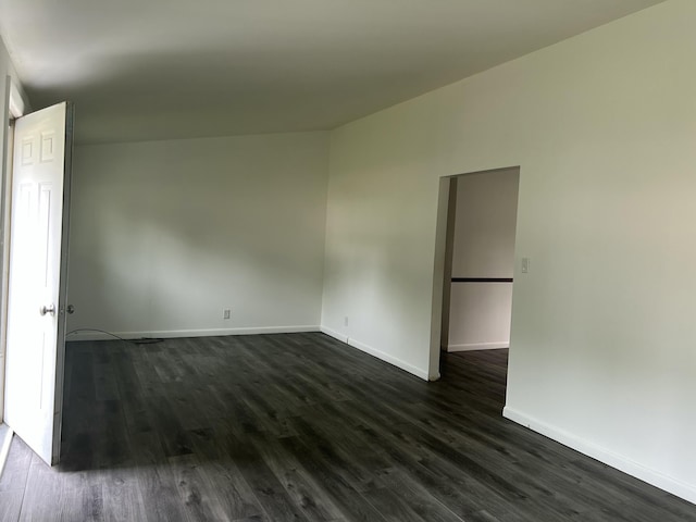 1283 Vesta Rd, Muskegon, MI 49445 - unfurnished room featuring dark wood-style floors and baseboards