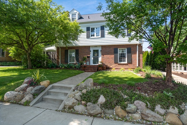 770 Bloomfield Blvd, Jackson, MI 49203 - view of front of house featuring brick siding and a front yard