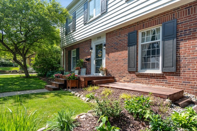770 Bloomfield Blvd, Jackson, MI 49203 - view of side of home featuring a lawn and brick siding